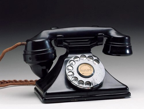 A black rotary telephone