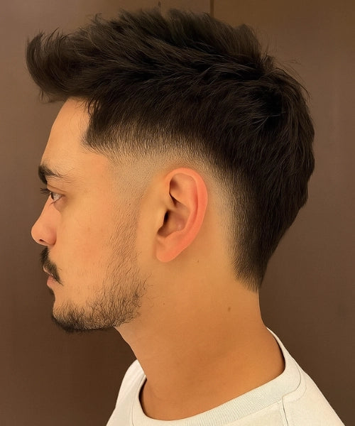 Quiff mullet hairstyle with voluminous quiff front and layered mullet back.