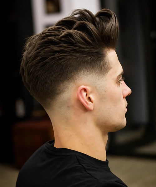 Loose quiff hairstyle with natural lifted top and faded sides for casual movement.