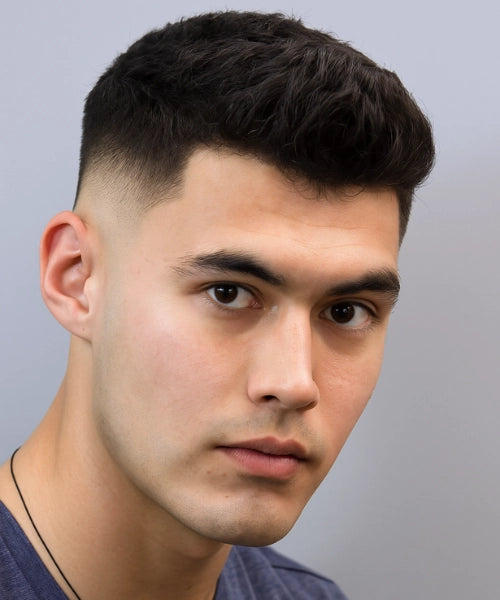 French crop quiff with short cropped fringe and voluminous textured top.