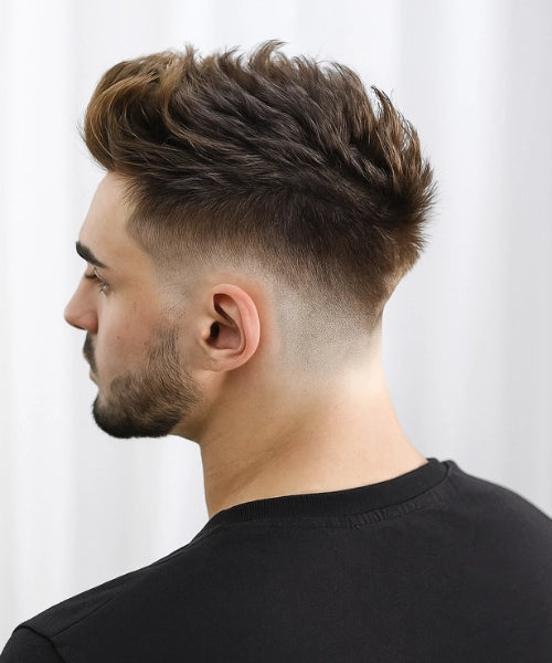 Spiky quiff hairstyle with tousled lifted spikes on top and sharp faded sides.