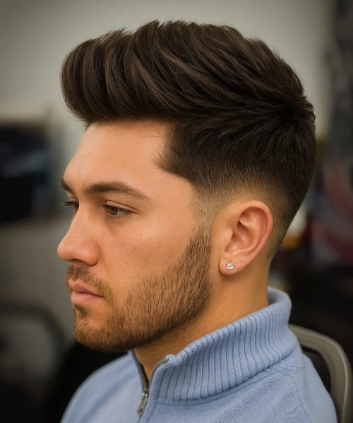 Layered quiff hairstyle with voluminous textured layers and low faded sides.