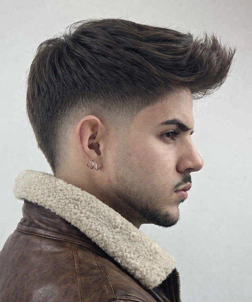 Forward quiff with short blended sides and a longer top pushed ahead, giving a full textured look with movement