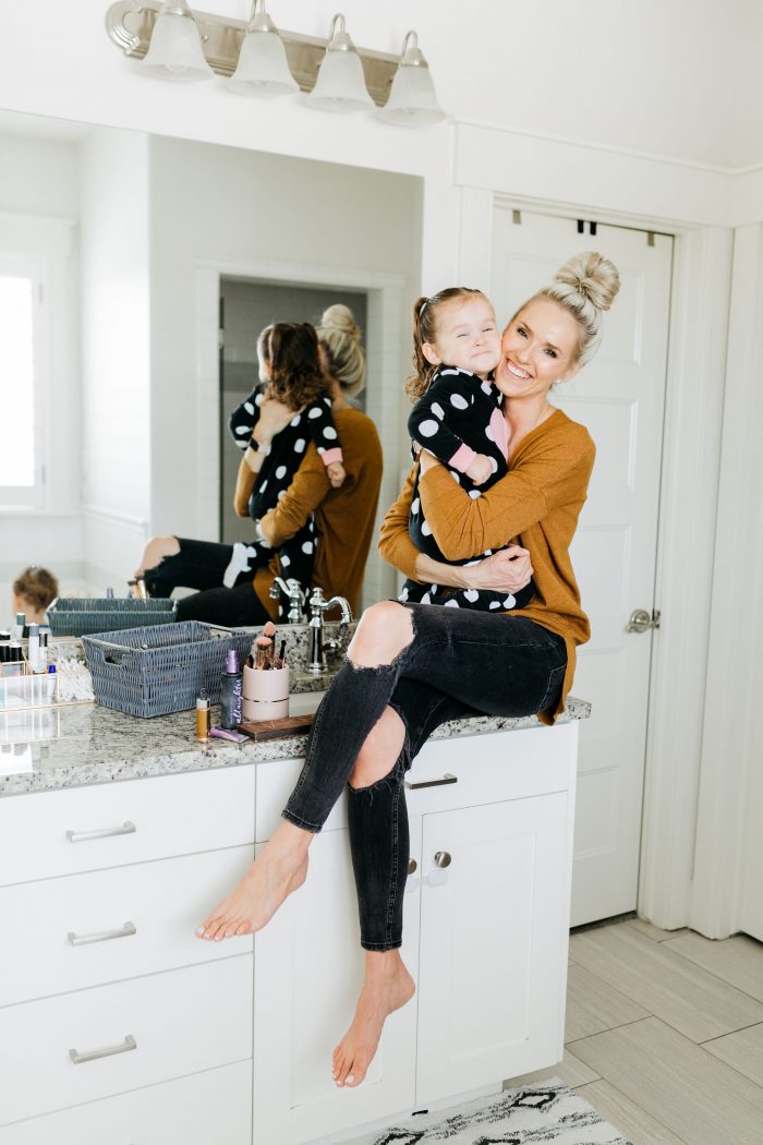 NAKED Palette Tutorial featured by top US beauty blog A Slice of Style; Image of woman in mustard sweater, applying eye shadow.