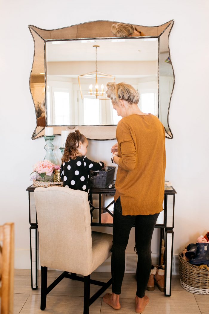 NAKED Palette Tutorial featured by top US beauty blog A Slice of Style; Image of woman in mustard sweater, applying eye shadow.